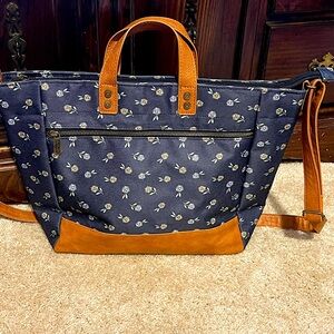 Fabulous work satchel in daisy print. Brand new with straps and handle